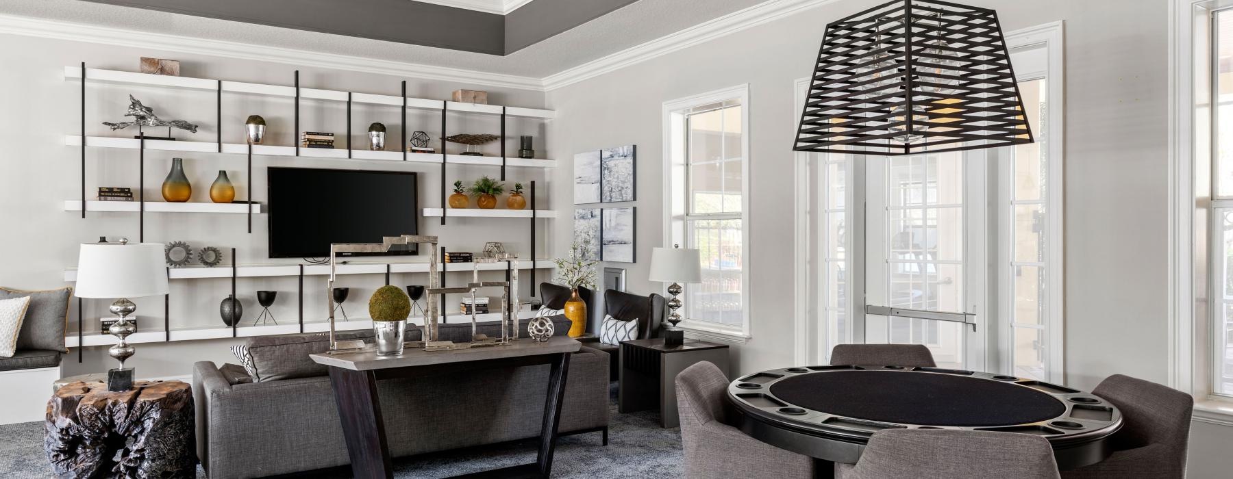 a lounge with a tv and couches