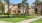a large house with palm trees