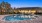 a large building with a pool in front of it
