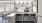 a kitchen with a bar and chairs
